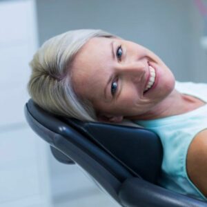 Woman smiling in the dental chair