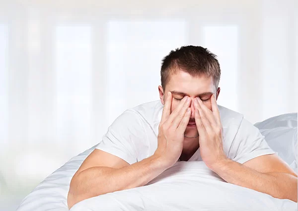 man struggling to get a good night's rest 